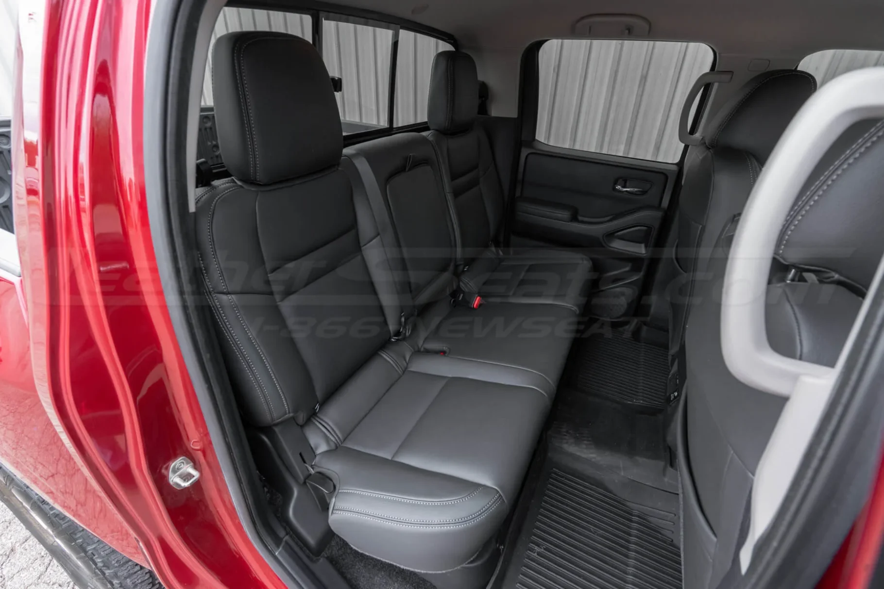 Aftermarket Dark Graphite leather seat upholstery installed in Nissan Frontier