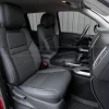 Passenger side custom replacement leather seat covers installed in Nissan Frontier