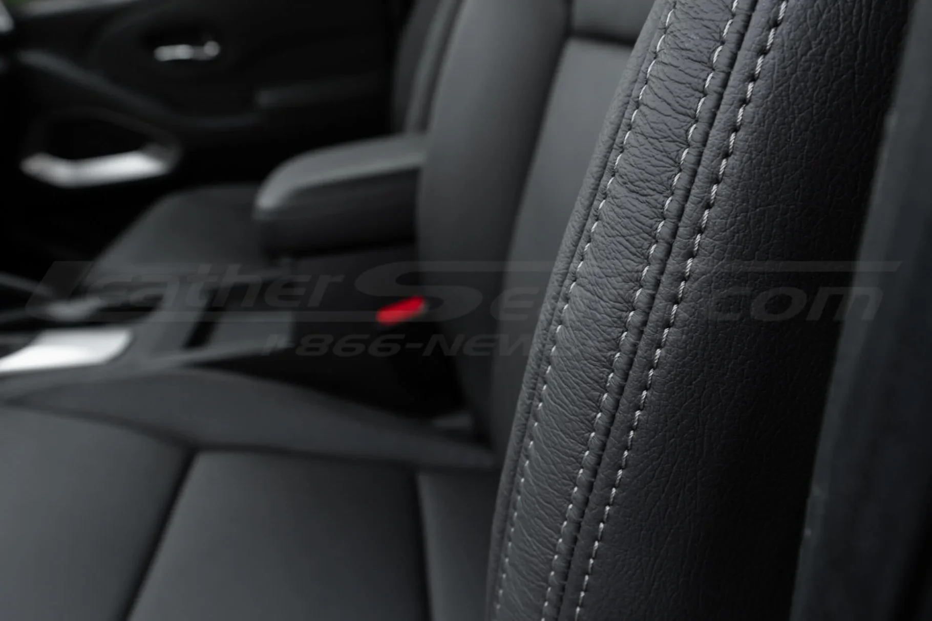 Contrasting Stone double-stitching on Dark Graphite leather close-up