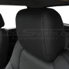 Dark Graphite leather headrest close-up with stone stitching